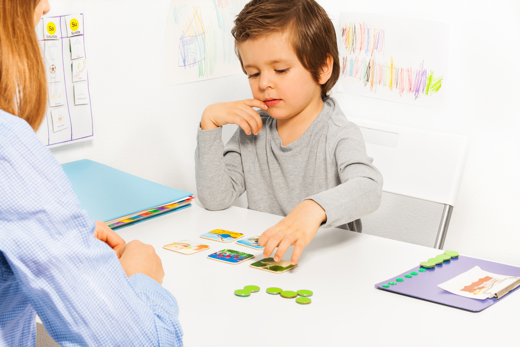 Preschooler Boy and Developing Game with Card